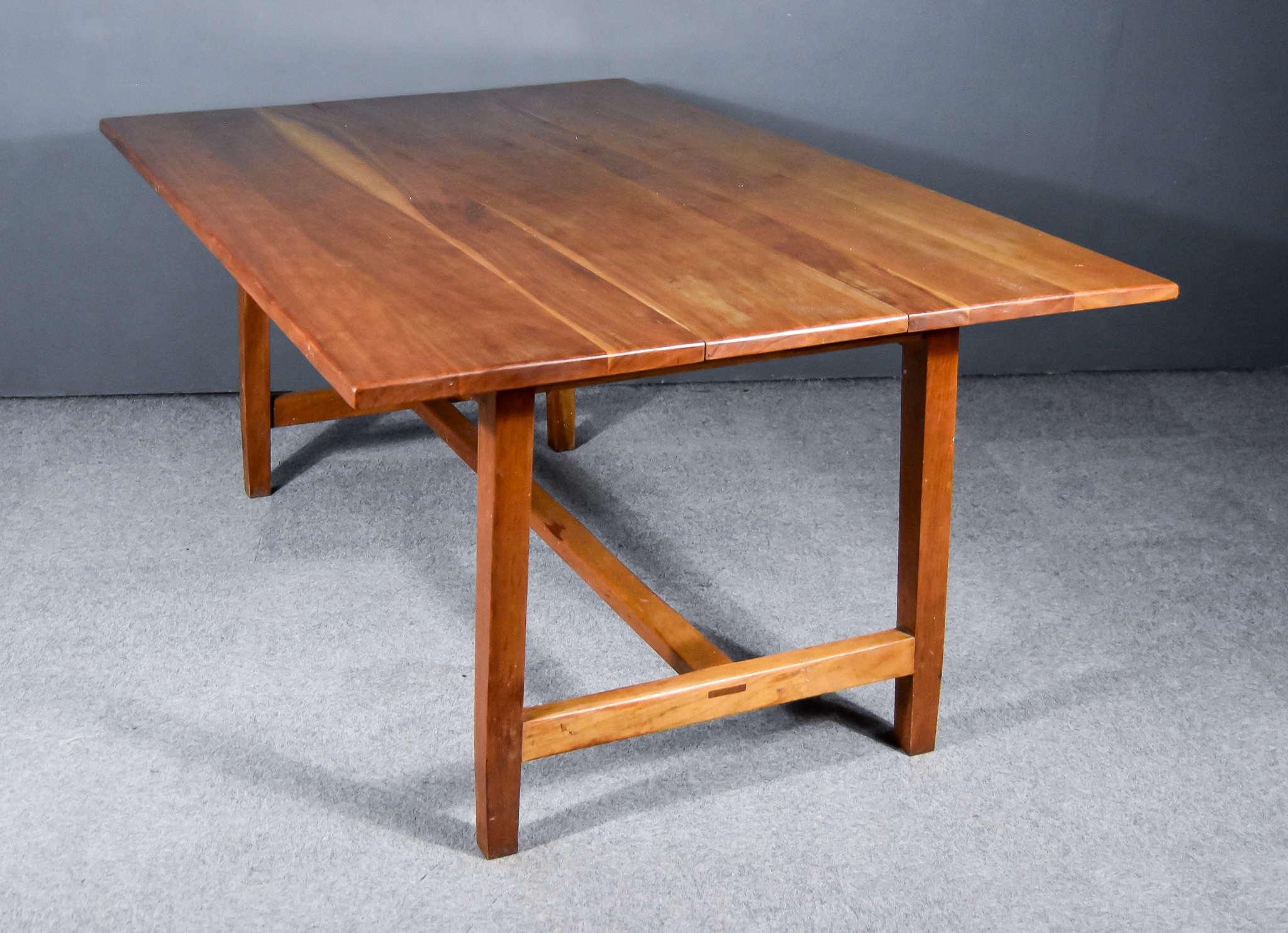 A Late 19th/Early 20th Century French Provincial Cherrywood Extending Dining Table, with one extra