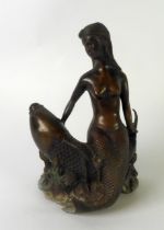 MODERN ORIENTAL PATINATED METAL GROUP Modelled as a mermaid sat on the back of a carp Unsigned 8” (