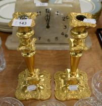 A PAIR OF GOLD PLATED CANDLESTICKS (2)