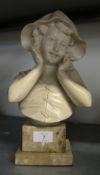 MANNER OF GIOVANNI DE MARTINO; RESIN CAST BUST OF A GIRL IN SOU'WESTER HAT