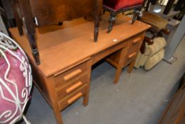 A MID CENTURY LIGHT OAK DOUBLE PEDESTAL TEACHERS DESK (A.F.)