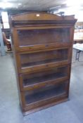 A LEBUS BOOKCASE IN OAK, IN FOUR SECTIONS, 154cm high x 88.5cm wide, NEEDS SLIGHT RESTORATION