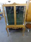 A BLEACHED WALNUT DISPLAY CABINET OF EARLY EIGHTEENTH CENTURY STYLE, WITH TWO PLATE GLASS SHELVES,