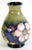 WALTER MOORCROFT POTTERY PEAR SHAPED VASE with tube lined decoration of large blooms on the lower