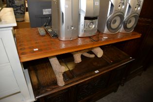 A COFFEE TABLE, ON HEAVY RUSTIC BASE (CANADIAN), HAVING OLD PENNY COINS INSET