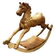 EARLY 20th CENTURY STRIPPED PINE ROCKING HORSE, the head with mouth open and carved mane, in full
