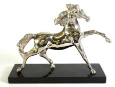 SILVER PLATED MODEL OF A GALLOPING HORSE, on black marble oblong base, 8in (20.5cm) high overall,