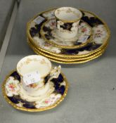 SEVEN PIECES OF EDWARDIAN COALPORT PORCELAIN viz; TWO COFFEE CUPS, TWO SAUCERS and THREE SIDE PLATES
