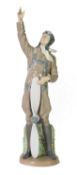 LLADRO PORCELAIN MODEL OF A WARTIME PILOT, standing with an upright propeller, his right hand