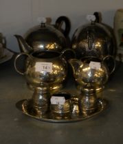 INTER-WAR YEARS HAMMERED PEWTER FOUR PIECE TEA and COFFEE SERVICE, also a FOUR PIECE CONDIMENT SET