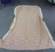 VINTAGE BEDSPREAD BY McCALLUM AND CRAIGIE LTD, SALMON PINK GEOMETRIC PATTERN WITH FRINGED EDGES