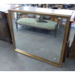 A GILT FRAMED RECTANGULAR WALL MIRROR, (99cm x 83cm)