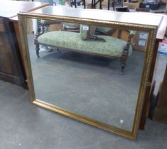 A GILT FRAMED RECTANGULAR WALL MIRROR, (99cm x 83cm)