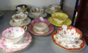 A HARLEQUIN SET OF EIGHT CUPS AND SAUCERS