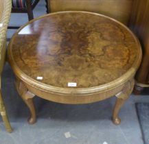 A 1930's CIRCULAR TOP COFFEE TABLE, RAISED ON CABRIOLE LEGS
