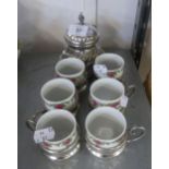 A SET OF SIX ELECTROPLATE COFFEE CUPS AND SAUCERS WITH FLORAL DECORATED CHINA LINERS AND A SUCRIER