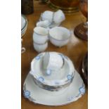 A STANDARD CHINA ‘DAISY SHAPE’ TEA AND DESSERT SERVICE, THE CUPS WITH EMBOSSED FLORAL HANDLES, 21