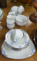 A STANDARD CHINA ‘DAISY SHAPE’ TEA AND DESSERT SERVICE, THE CUPS WITH EMBOSSED FLORAL HANDLES, 21