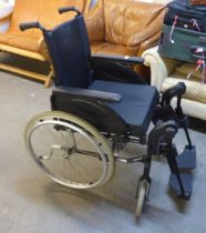 A FOLDING WHEELCHAIR BY INVACARE