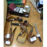 A COLLECTION OF 8 SMOKING PIPES WITH WOODEN HEADS, TOGETHER WITH A COLLECTION OF LIGHTERS TO