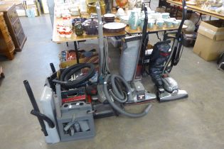 TWO KIRBY VACUUM CLEANERS AND A KIRBY HARD-FLOOR CLEANER WITH ACCESSORIES