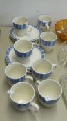 A LINDA BARKER 'CHURCHILL' SET OF EIGHT COFFEE CUPS AND SAUCERS