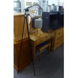 A MODERN BLACK METAL TRIPOD STANDARD LAMP AND A TRIPOD TABLE LAMP AND STYLISH GREY LOW OPEN