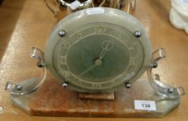 A 1950's ELECTRIC MANTEL CLOCK, HAVING A MARBLE CIRCULAR DIAL
