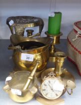 A BRASS CIRCULAR TRIVET; A BRASS MINIATURE COAL BUCKET; A PAIR OF BRASS CHAMBER CANDLESTICKS AND