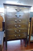 A MAHOGANY MUSIC CABINET WITH SIX FALL FRONT DRAWERS