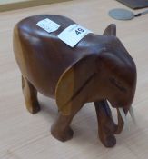 A CARVED WOOD ELEPHANT, APPROX 17cm HIGH
