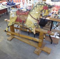 AN EDWARD VII DAPPLED ROCKING HORSE ON SWING BASE (IN NEED OF RESTORATION)