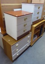 TWO WOOD-EFFECT AND WHITE MELAMINE BEDSIDE CHESTS OF THREE DRAWERS AND A SIMILAR LOW CHEST OF