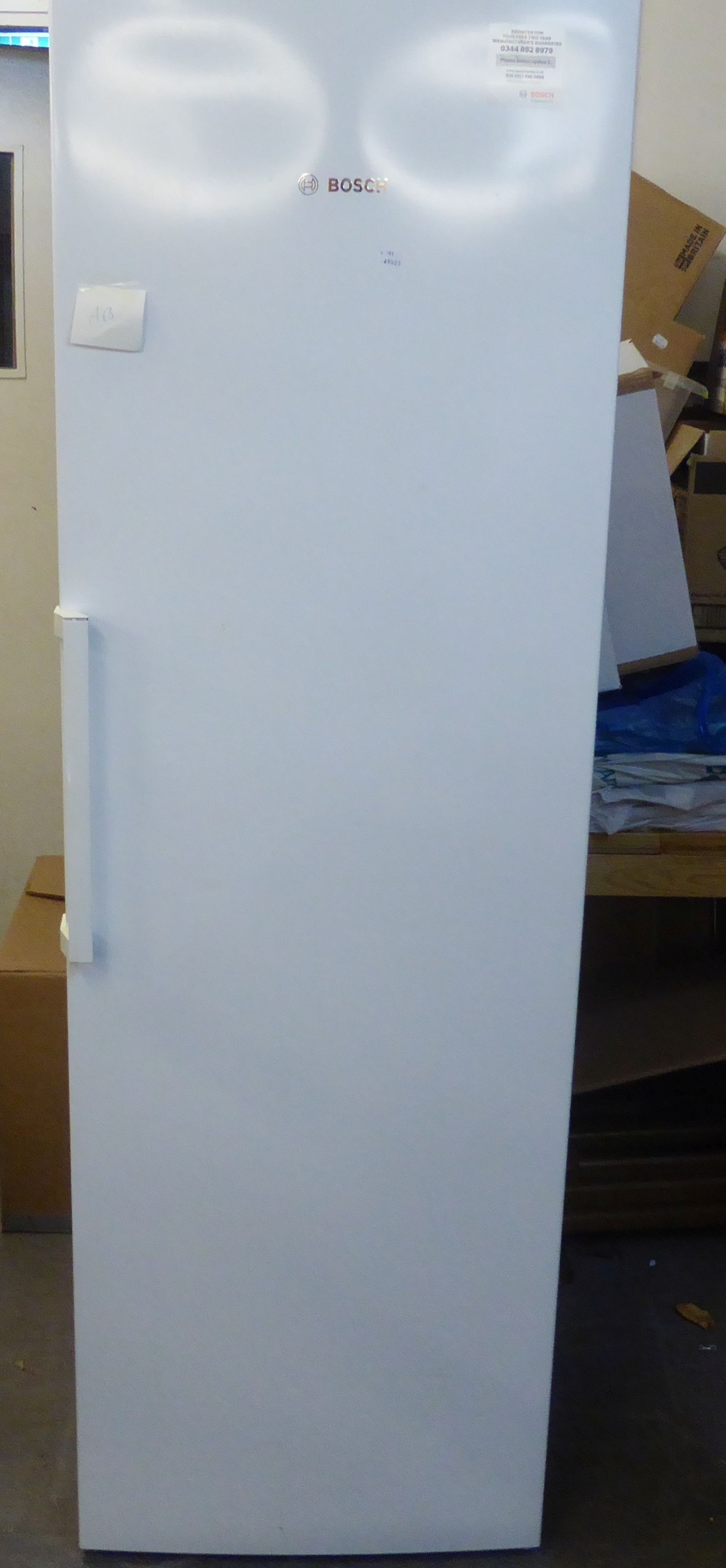 A BOSCH LARGE UPRIGHT FREEZER (ONE DRAWER MISSING)