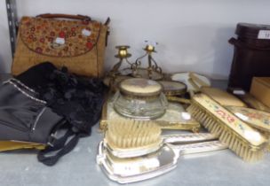 AN EIGHT PIECE GILT METAL AND FLORAL EMBROIDERED DRESSING TABLE SET WITH TRAY AND OTHER DRESSING