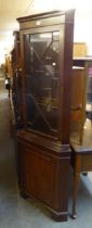 A MAHOGANY DOUBLE CORNER CUPBOARD WITH ASTRAGAL GLAZED DOOR ABOVE