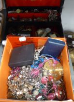 A JEWELLERY CASE CONTAINING A SILVER CHARM BRACELET AND A LARGE QUANTITY OF COSTUME JEWELLERY TO