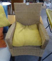 A STYLISH WICKER ARMCHAIR