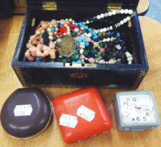 A MOROCCO CLAD JEWELLERY CASKET, CONTAINING BEAD NECKLACES AND THREE TRAVEL ALARM CLOCKS