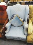 1930's WING ARMCHAIR, IN BLUE EMBROIDERED FABRIC AND ON CABRIOLE LEGS