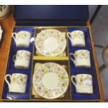 A BOXED COALPORT CHINA 'SOMERSET' PATTERN SET OF SIX COFFEE CUPS AND SAUCERS