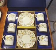 A BOXED COALPORT CHINA 'SOMERSET' PATTERN SET OF SIX COFFEE CUPS AND SAUCERS