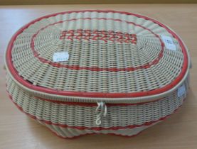 A SEWING BASKET WITH COLLARS, A LARGE QUANTITY OF BUTTONS AND SEWING IMPLEMENTS, PLUS SOME MATERIAL