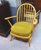 AN ERCOL LOW SEATED STICK-BACK OPEN ARMCHAIR, AND A CARVED OAK GATELEG OCCASIONAL TABLE (A.F.) (2)