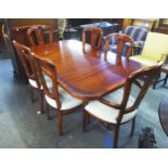 A GOOD QUALITY REPRODUCTION DINING ROOM SUITE COMPRISING; A DISPLAY CABINET, TWIN PEDESTAL DINING