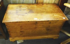 A VICTORIAN PINE BLANKET BOX, WITH FITTED CANDLE BOX, RAISED ON TURNED FEET