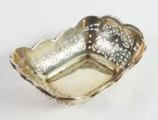 GEORGE VI PIERCED SILVER BON BON DISH, of rounded oblong form with shaped rim, 1 ½” (3.8cm) high, 4”