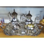 F B ROGERS, GEORGIAN STYLE FOUR PIECE ELECTROPLATED TEASET AND THE TWO HANDLED TRAY with floral