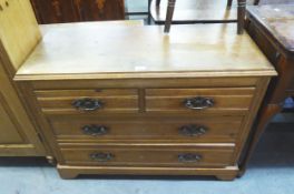 AN ANTIQUE LIGHT OAK CHEST OF TWO SHORT OVER TWO LONG DRAWERS, RAISED ON PLINTH BASE