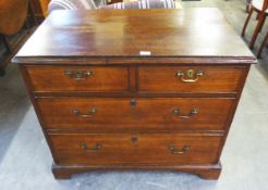 A GEORGE III OAK CHEST OF TWO SHORT OVER TWO LONG DRAWERS, HAVING SWAN NECK HANDLES AND RAISED ON